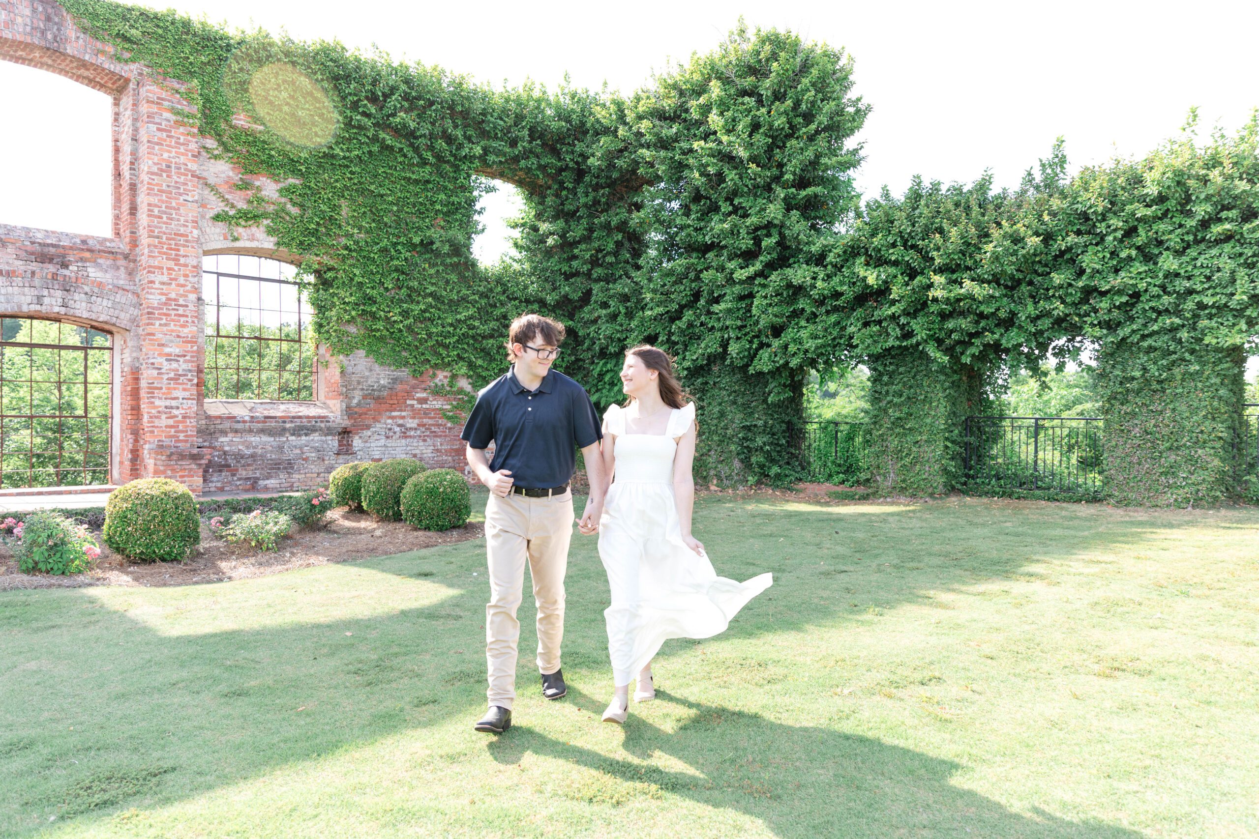 couple walking through garden at Bibb Mill